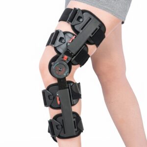 Full lateral view of a post-operative hinged knee brace fitted securely on a patient's leg.