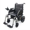 Three-quarter view of a lightweight, foldable electric wheelchair with a grey textured seat and backrest, silver metal frame, and a joystick controller on the left armrest, set against a white background."