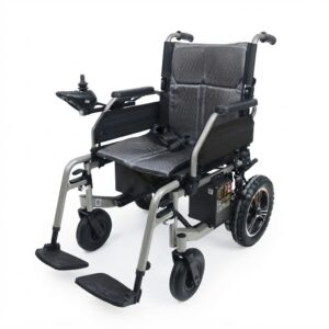Three-quarter view of a lightweight, foldable electric wheelchair with a grey textured seat and backrest, silver metal frame, and a joystick controller on the left armrest, set against a white background."