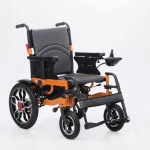 Orange frame folding electric wheelchair with grey patterned upholstery and right-side joystick controller, viewed at a three-quarter angle.