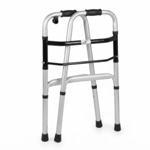 Side perspective of a silver and black medical walker folded flat for compact storage and easy vehicle transport.